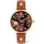 Police Brown Leather Watch with a gold-tone case, black dial featuring skull and floral design, and brown strap with stud accents.