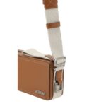 Jacquemus Le Cuerda Horizontal Shoulder Bag in brown leather with a beige strap and silver-tone hardware on display.