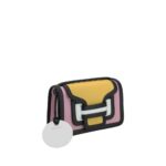Pierre Hardy Alpha Handbag in yellow, pink, and black color block design with a white circular tag attached.